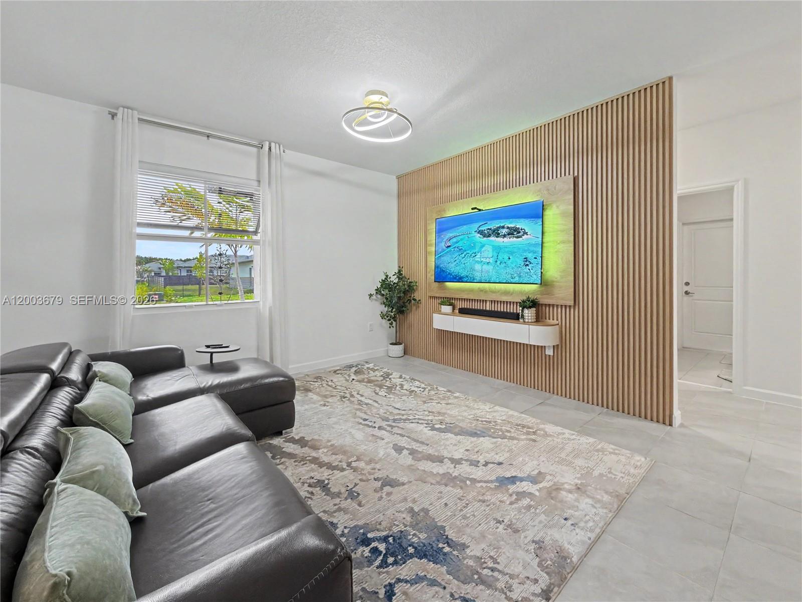 13218 Southwest 189th Terrace Miami, FL 33177 - Photo 8 of 47 a living room with furniture window and flat screen tv