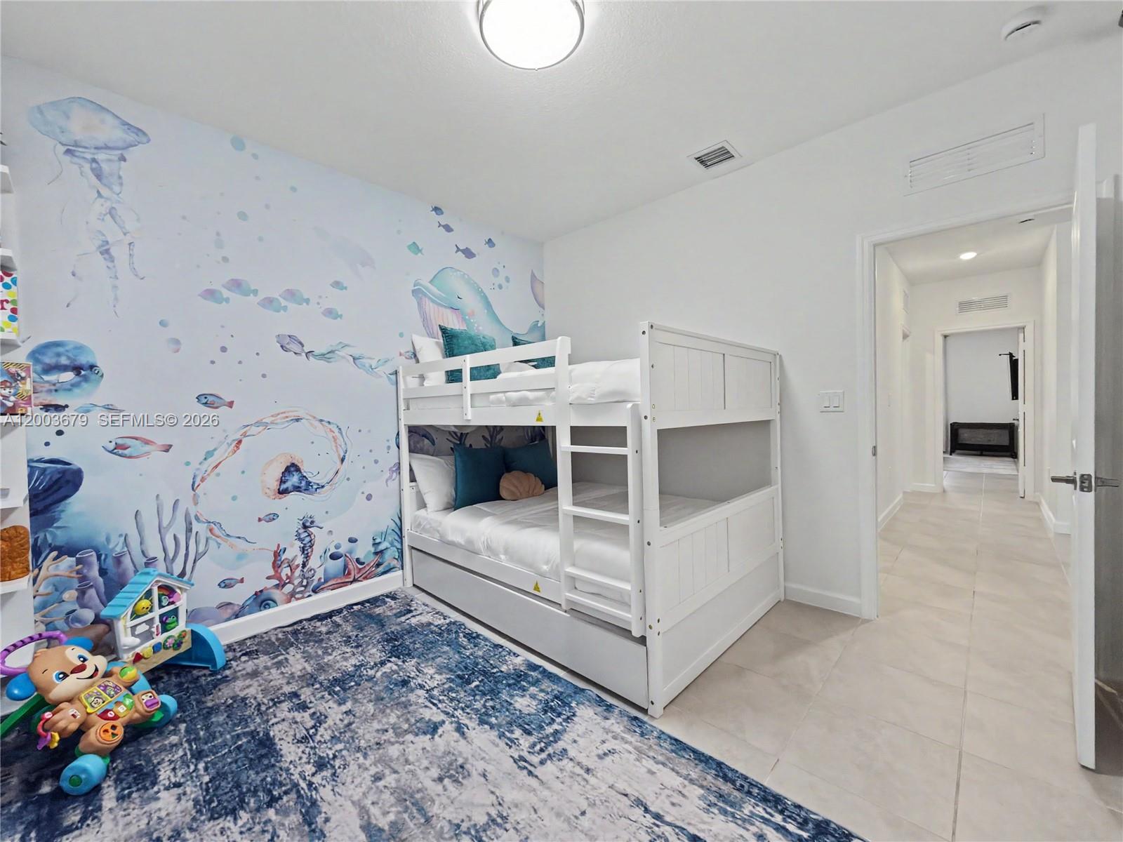 13218 Southwest 189th Terrace Miami, FL 33177 - Photo 10 of 47 a view of bedroom with baby crib
