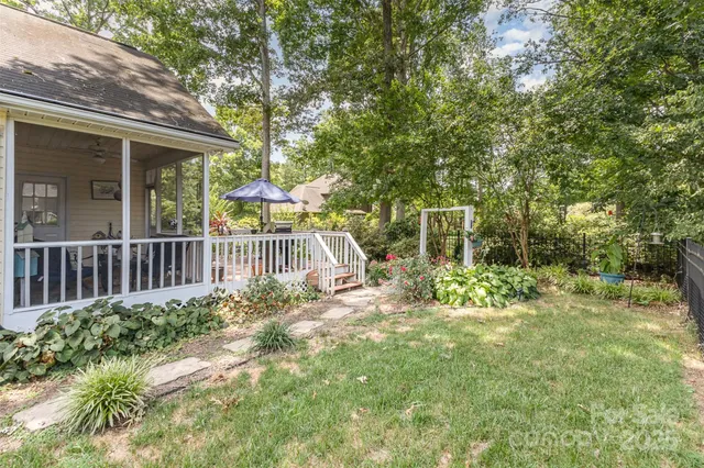 a view of a house with a small yard and plants