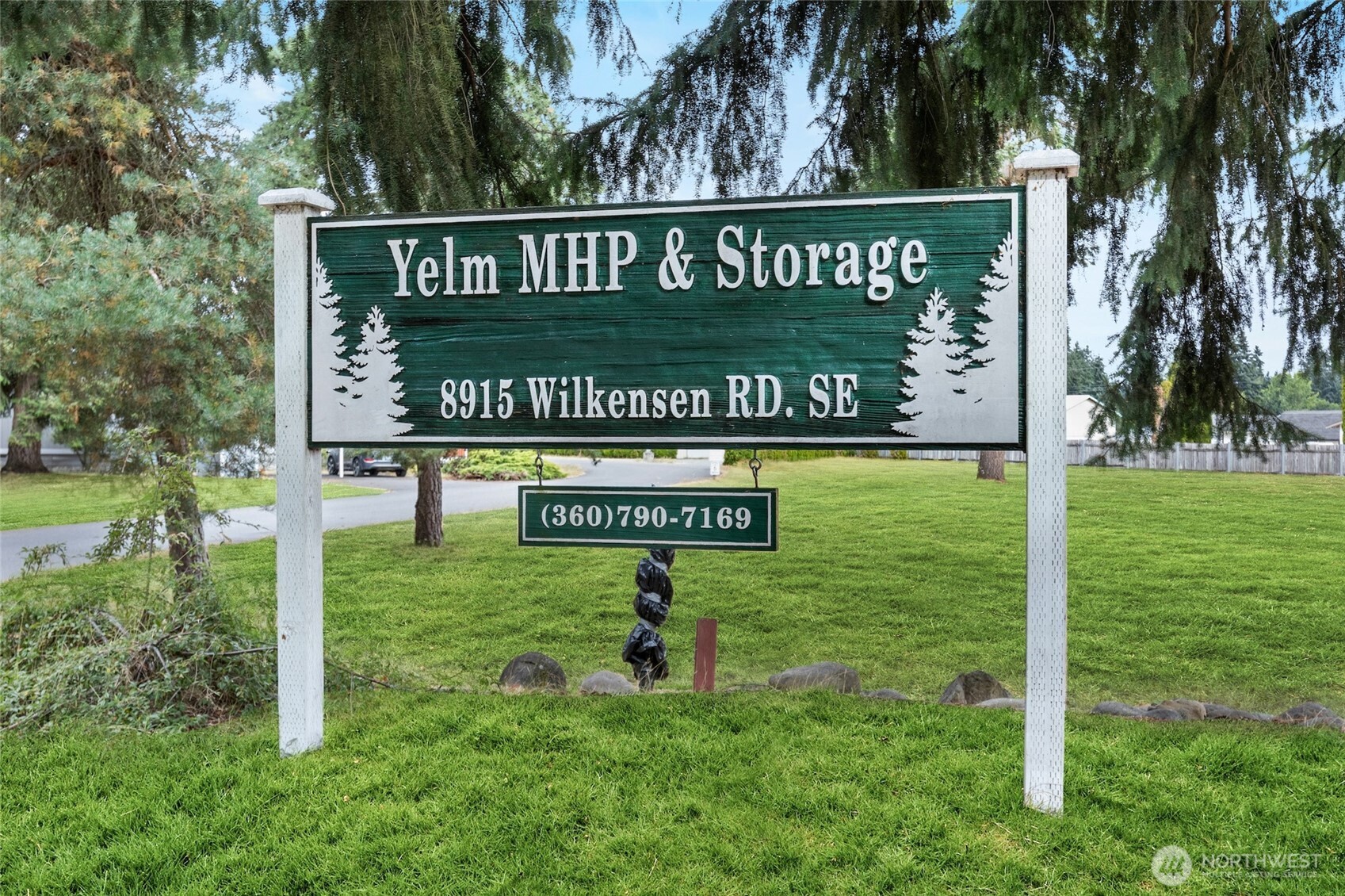8915 Wilkensen Road Southeast, Unit 3 Yelm, WA 98597 - Photo 16 of 16 a sign on the side of the road