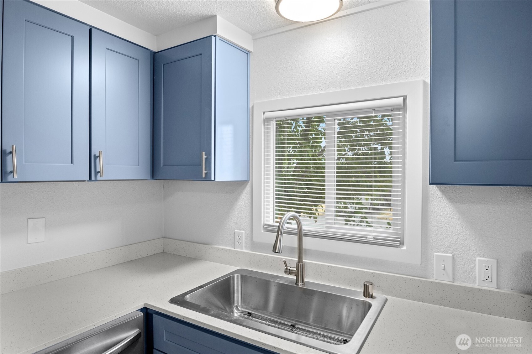 8915 Wilkensen Road Southeast, Unit 3 Yelm, WA 98597 - Photo 6 of 16 a kitchen with a sink and a window