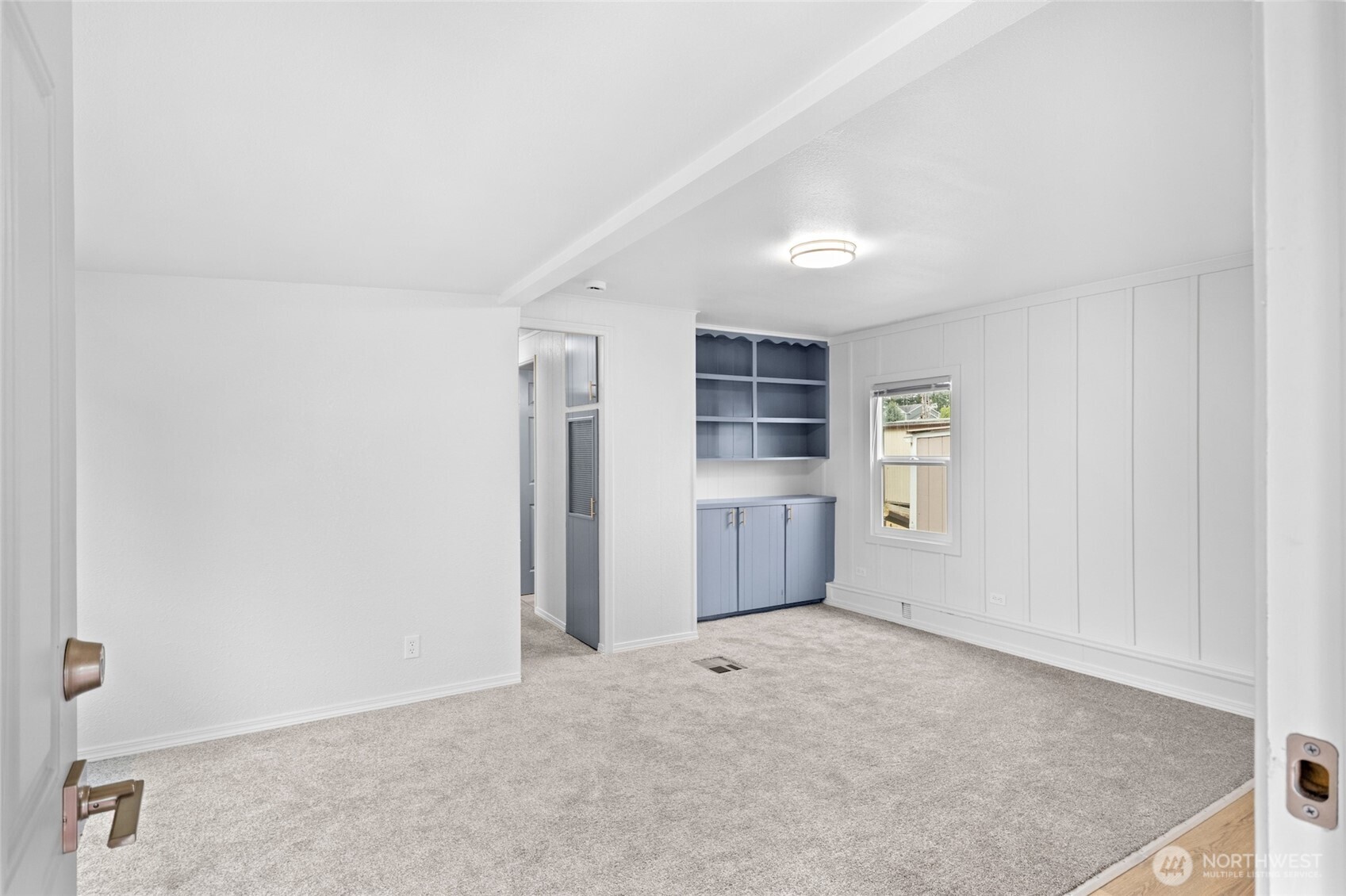 8915 Wilkensen Road Southeast, Unit 3 Yelm, WA 98597 - Photo 9 of 16 an empty room with windows