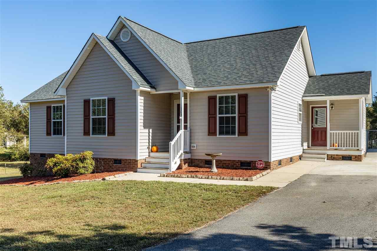 103 Holly Ranch Court Willow Spring, NC 27592 - Photo 2 of 30 a front view of a house with a yard