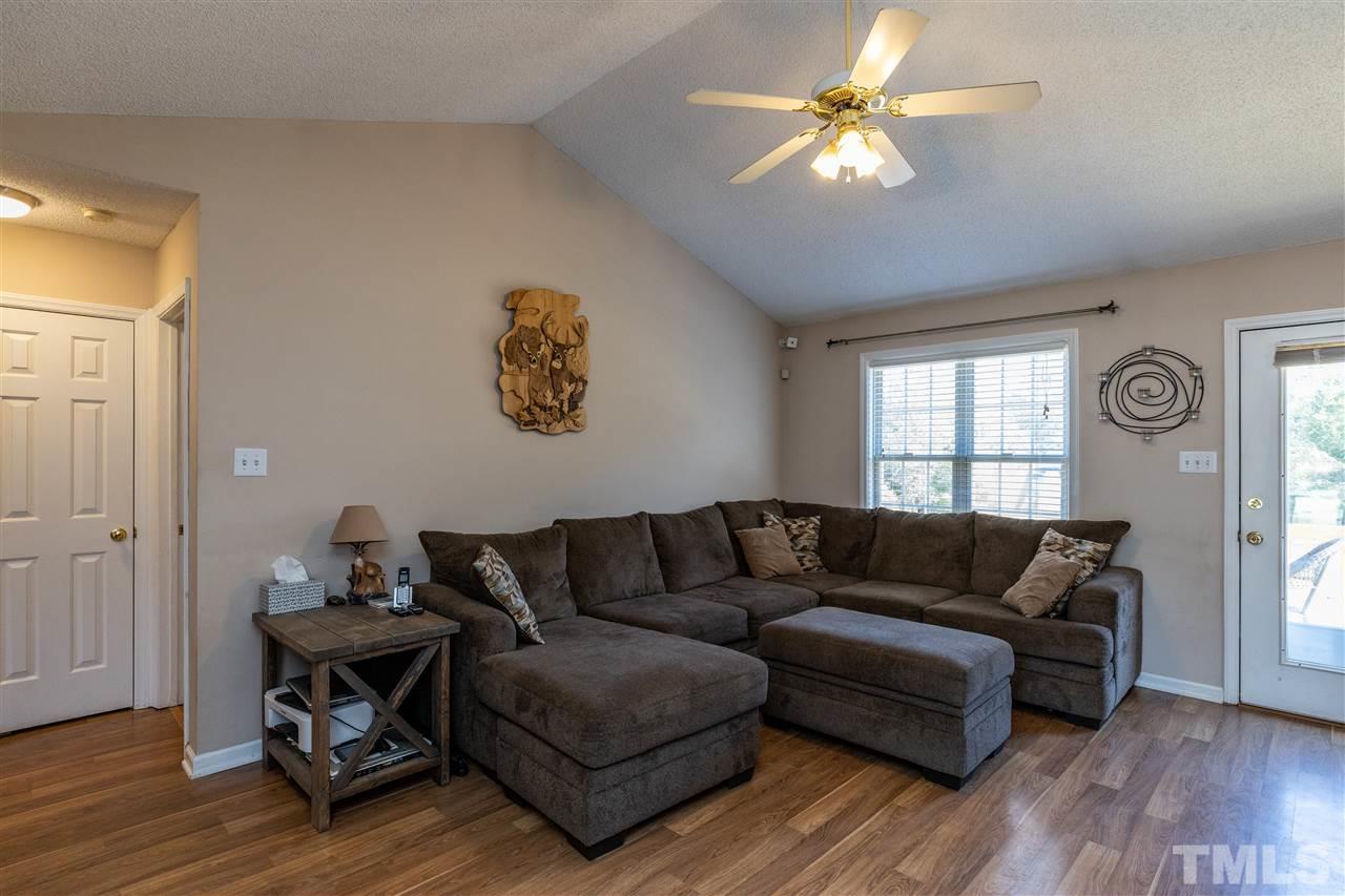 103 Holly Ranch Court Willow Spring, NC 27592 - Photo 12 of 30 a living room with furniture and a window
