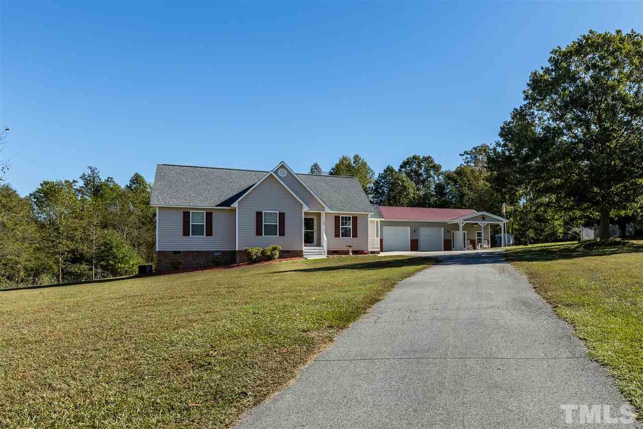 103 Holly Ranch Court Willow Spring, NC 27592 - Photo 3 of 30 a front view of a house with yard