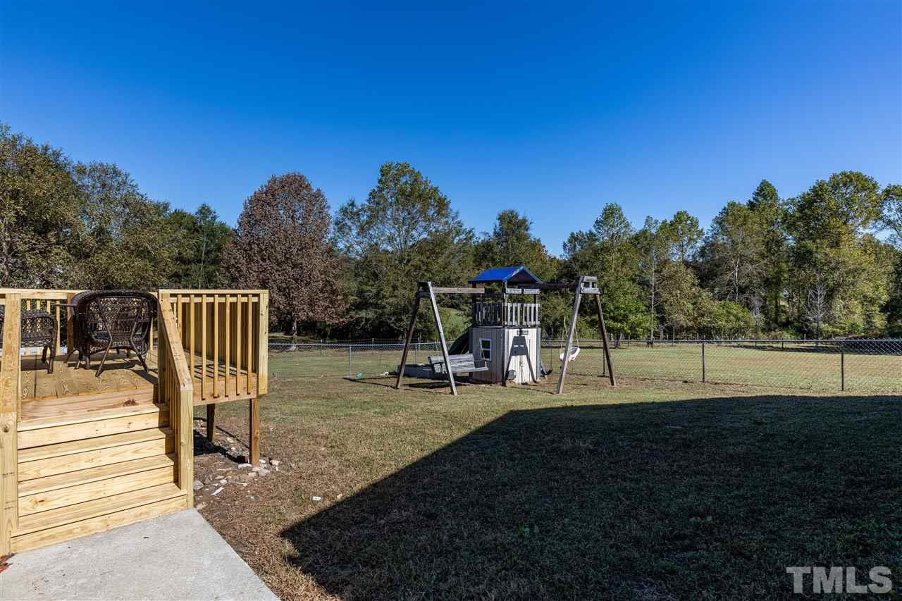 103 Holly Ranch Court Willow Spring, NC 27592 - Photo 25 of 30 a view of a park with swings