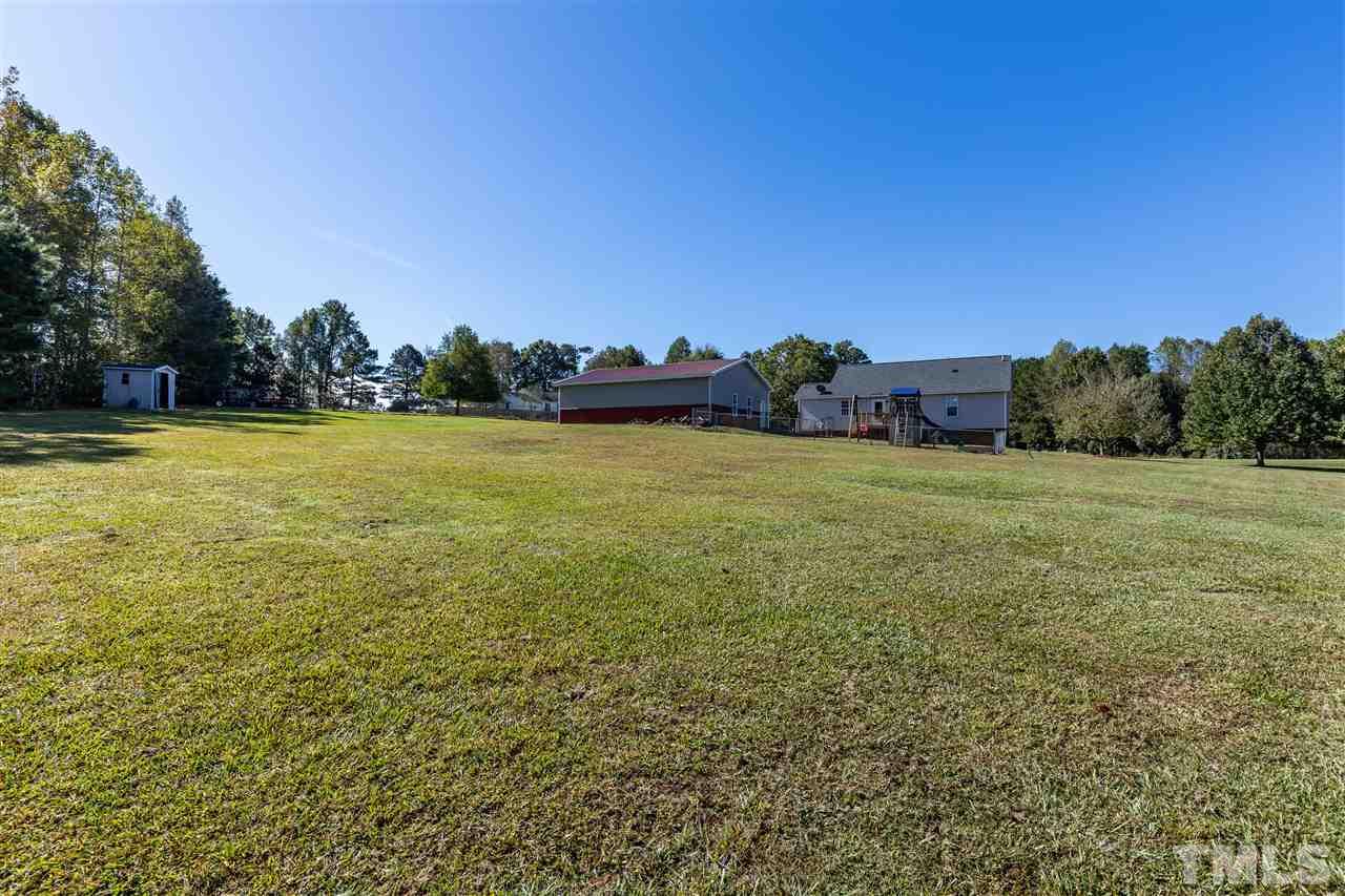 103 Holly Ranch Court Willow Spring, NC 27592 - Photo 27 of 30 a view of a field with an ocean view