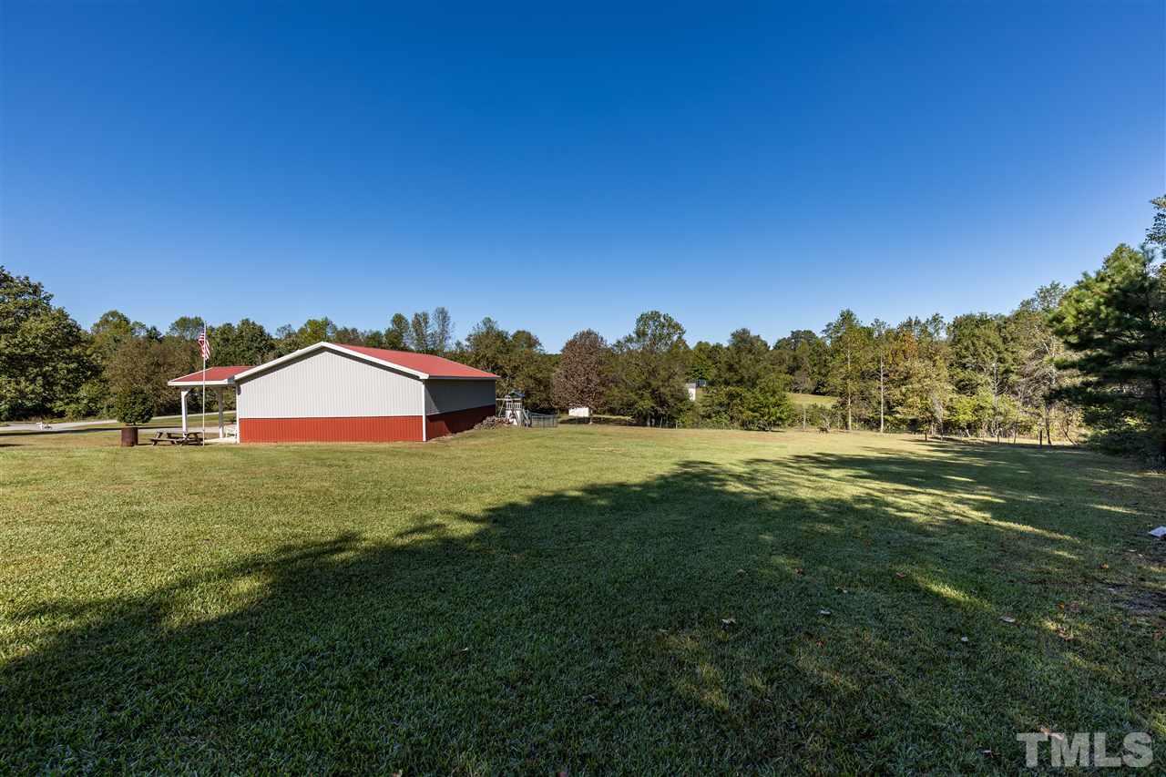 103 Holly Ranch Court Willow Spring, NC 27592 - Photo 28 of 30 a front view of a house with garden