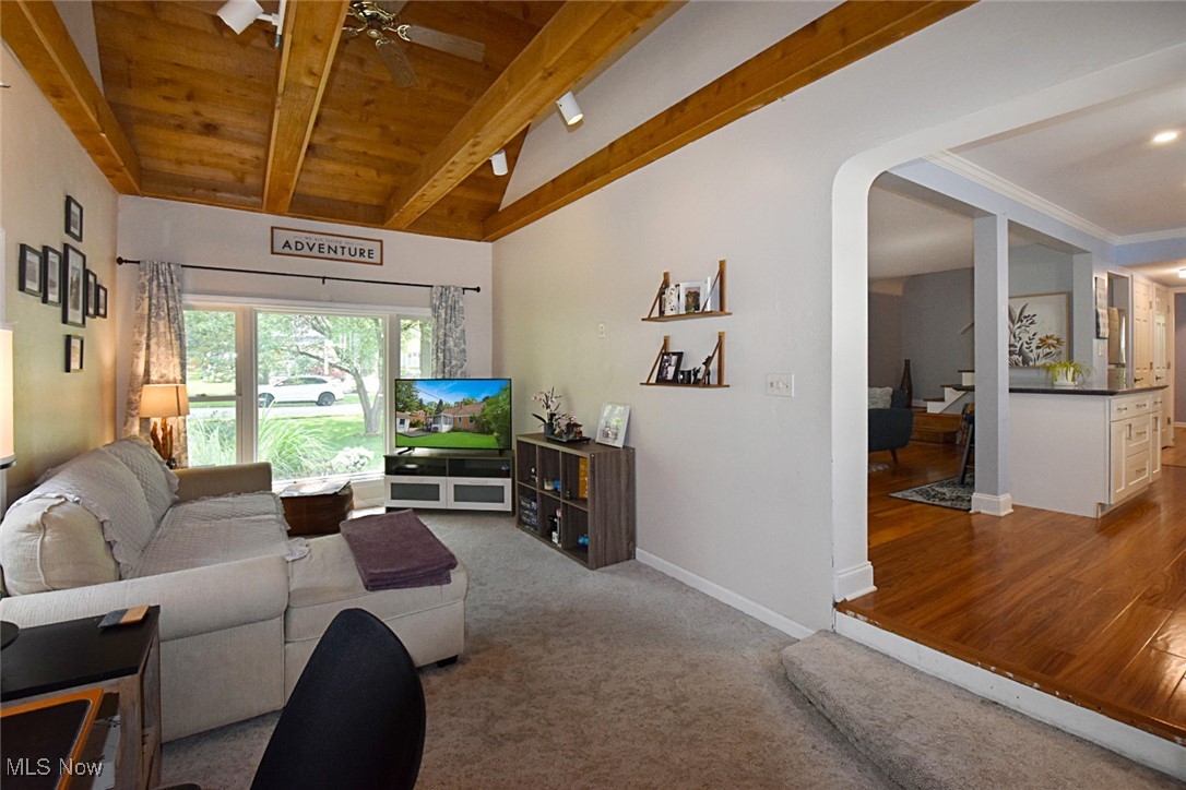 1388 Ford Road Lyndhurst, OH 44124 - Photo 12 of 39 Living room featuring lofted ceiling with beams, carpet, ceiling fan, and wooden ceiling