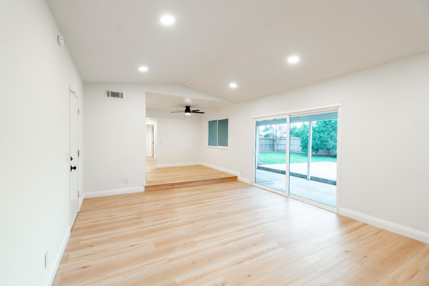2612 Renn Avenue Clovis, CA 93611 - Photo 11 of 36 a view of empty room with wooden floor and fan