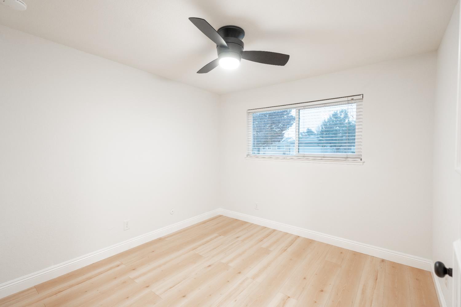 2612 Renn Avenue Clovis, CA 93611 - Photo 17 of 36 a view of empty room with wooden floor