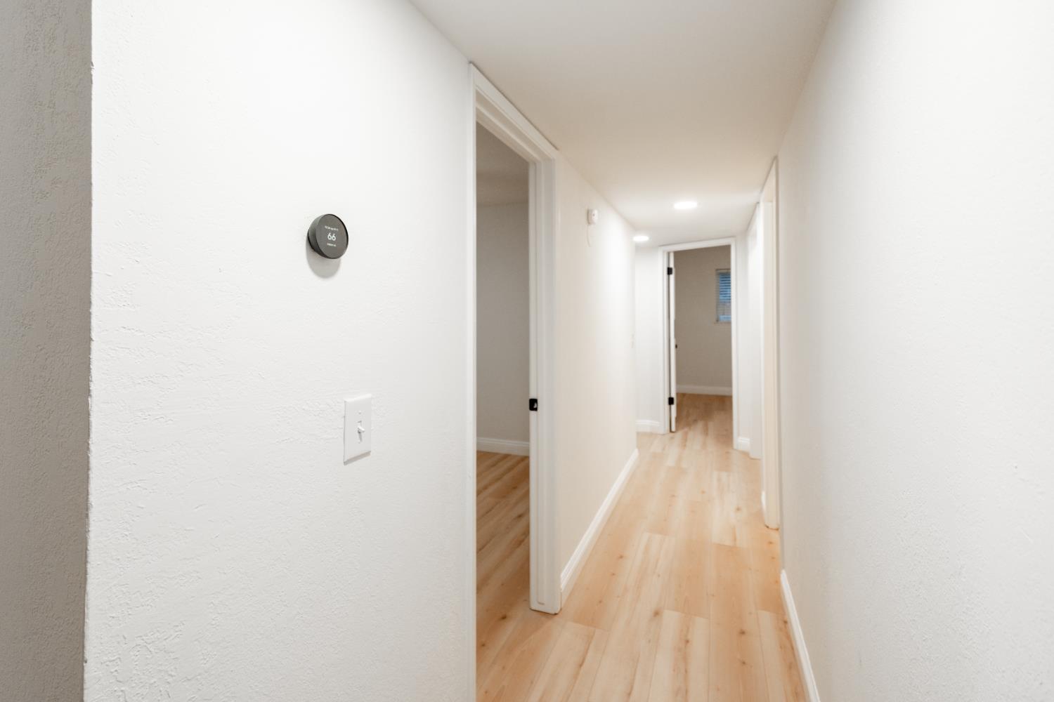 2612 Renn Avenue Clovis, CA 93611 - Photo 20 of 36 a view of a hallway with wooden floor