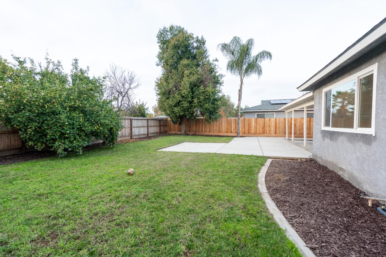 2612 Renn Avenue Clovis, CA 93611 - Photo 27 of 36 a view of a backyard with a garden