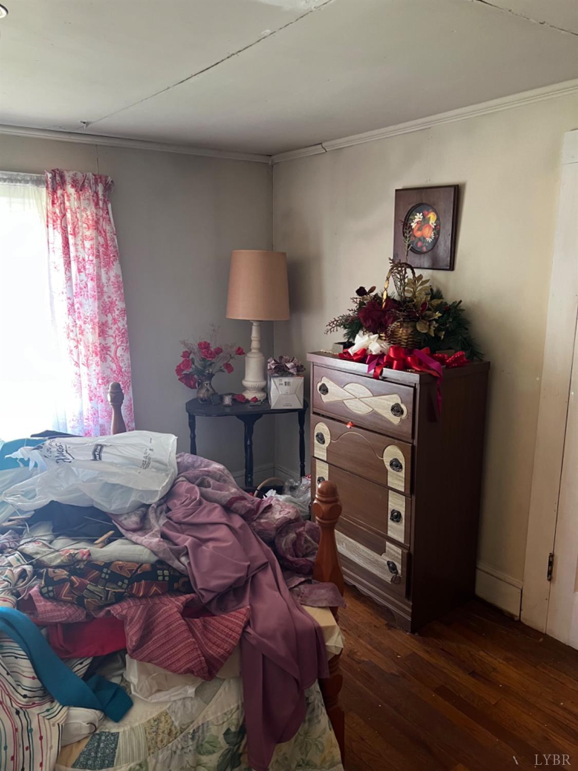 1131 Cody Road Nathalie, VA 24577 - Photo 16 of 28 a bed room with a bed dresser and a window