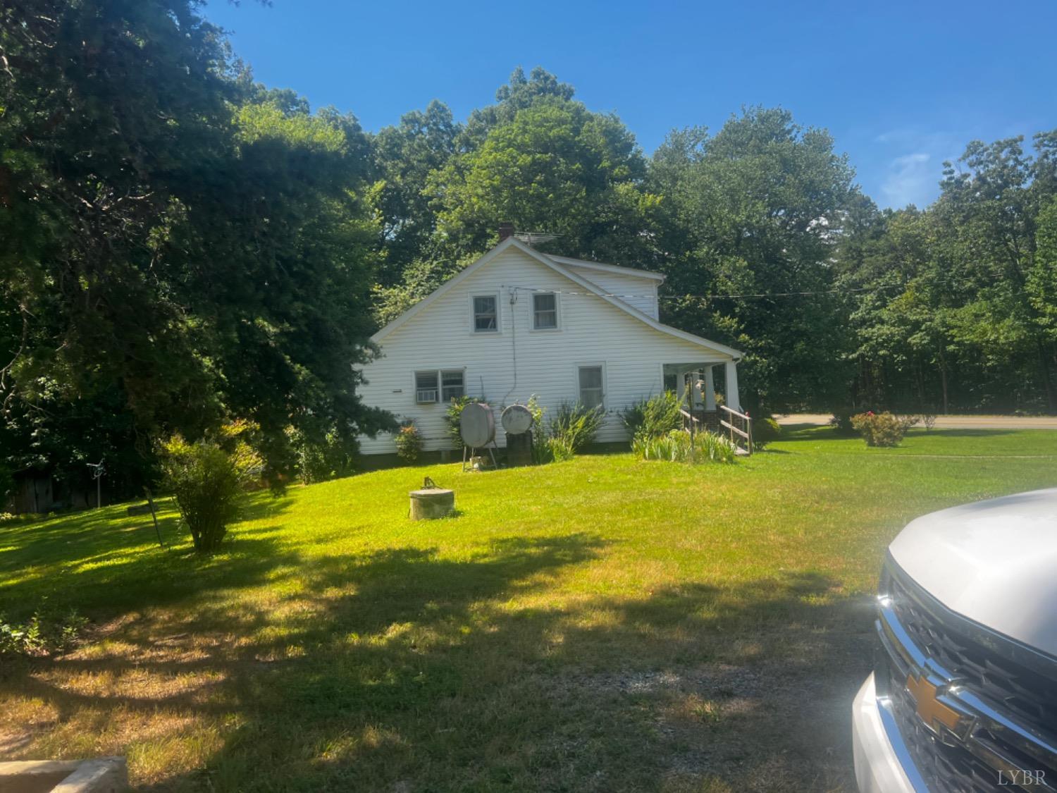 1131 Cody Road Nathalie, VA 24577 - Photo 25 of 28 a view of a house with swimming pool and yard
