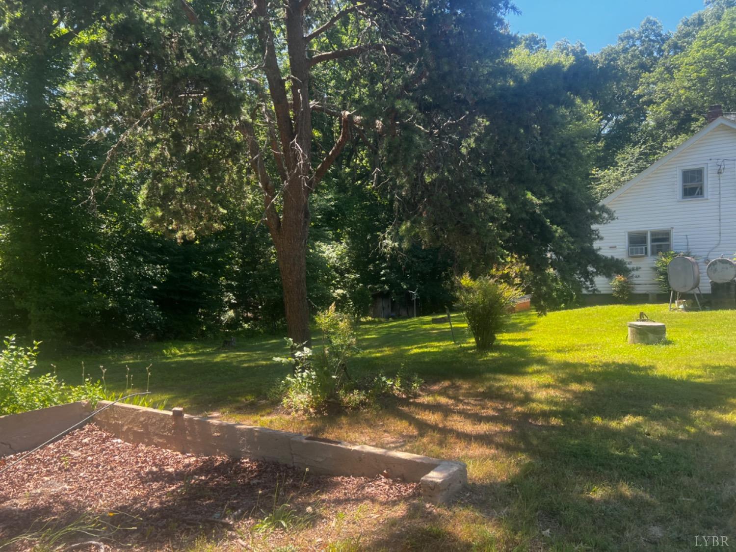 1131 Cody Road Nathalie, VA 24577 - Photo 26 of 28 a view of swimming pool with a yard