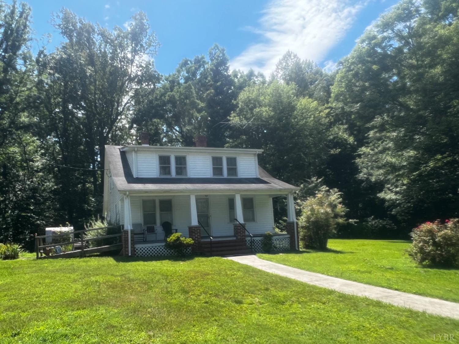 1131 Cody Road Nathalie, VA 24577 - Photo 28 of 28 a front view of a house with a yard