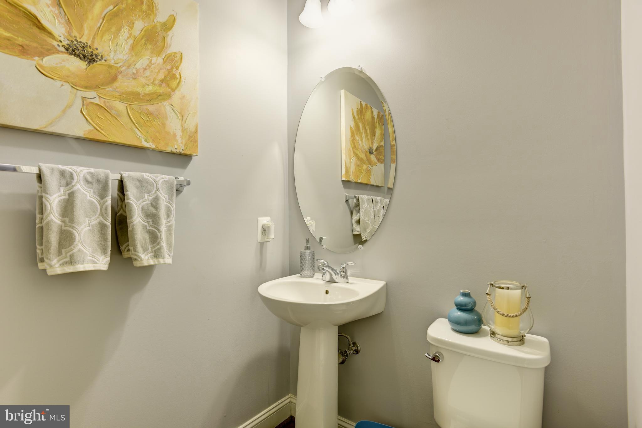 81 Linden Place Baltimore, MD 21286 - Photo 15 of 56 a bathroom with a sink and a mirror