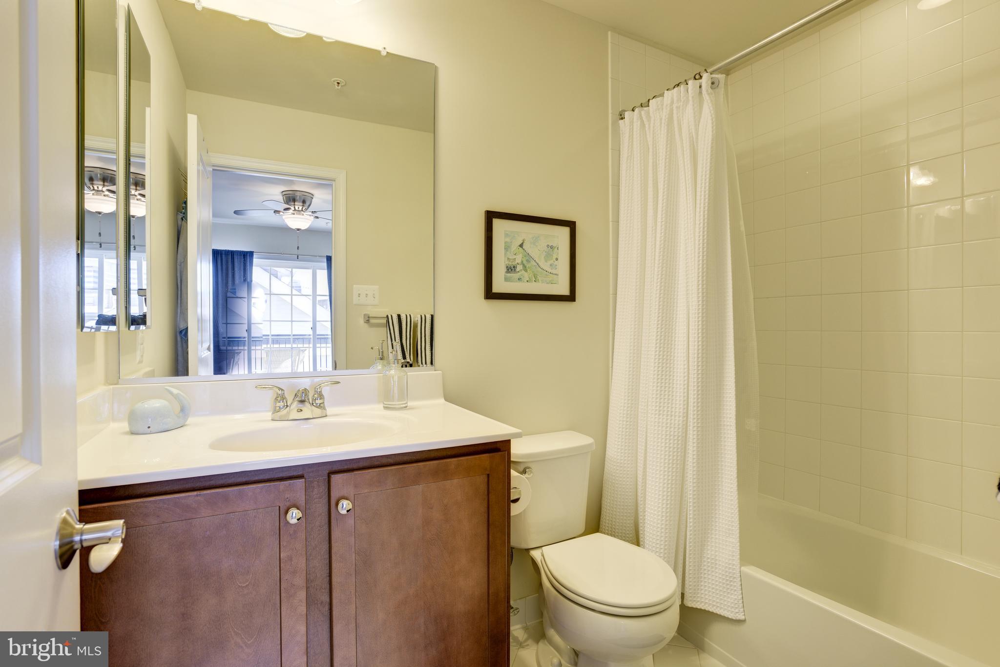 81 Linden Place Baltimore, MD 21286 - Photo 36 of 56 a bathroom with a sink a toilet and shower
