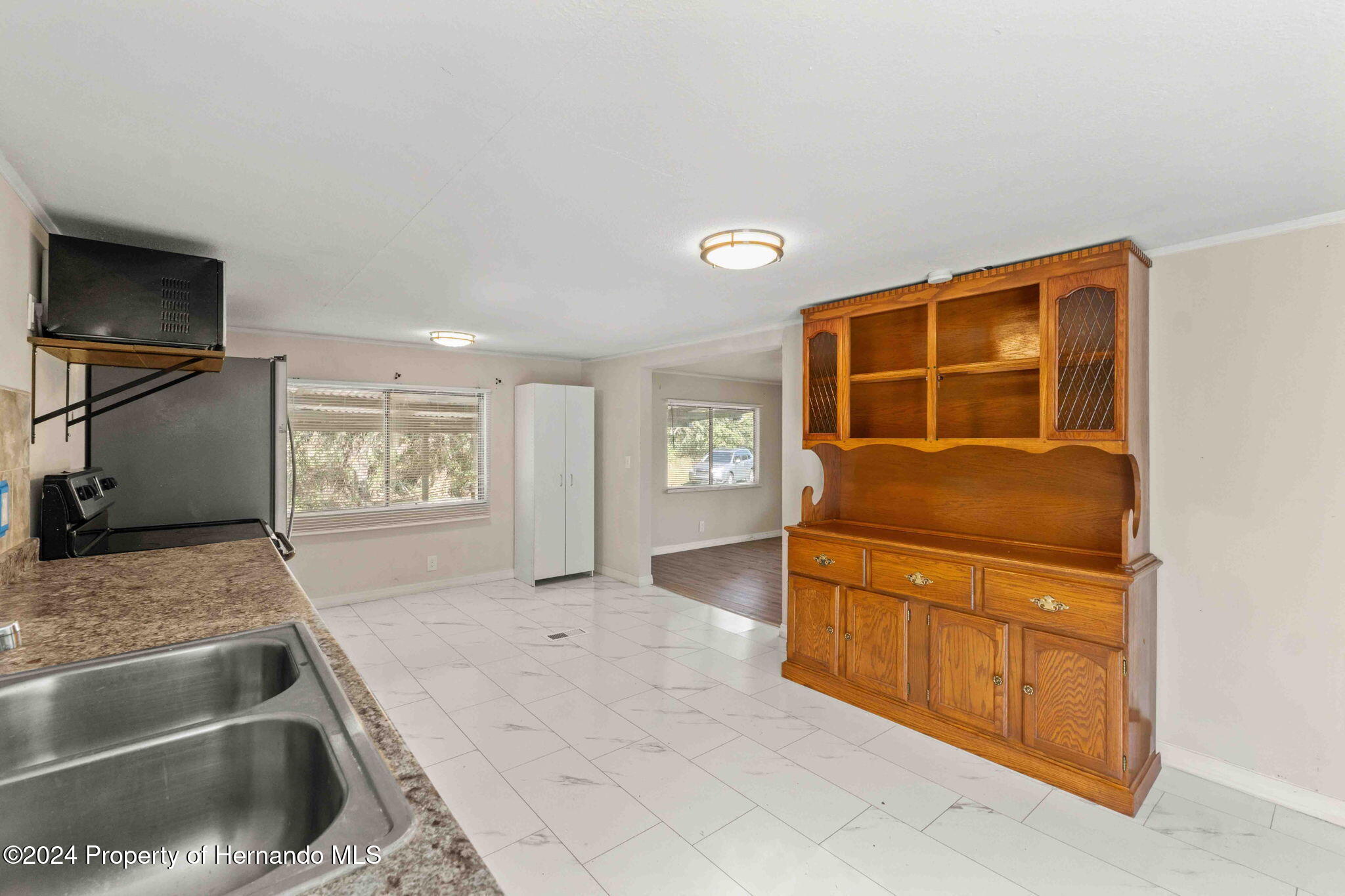 4265 North Beginning Path Crystal River, FL 34428 - Photo 14 of 30 a kitchen with granite countertop a sink and a stove top oven