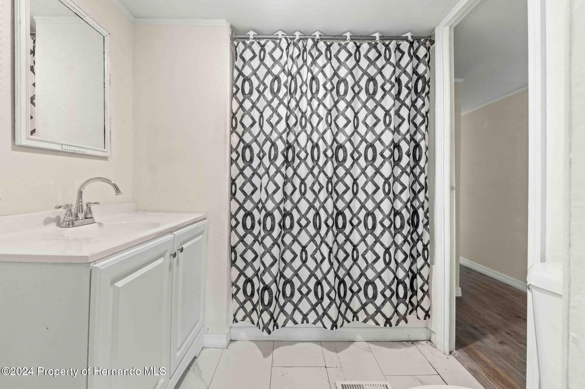 4265 North Beginning Path Crystal River, FL 34428 - Photo 24 of 30 a bathroom with a sink and a mirror