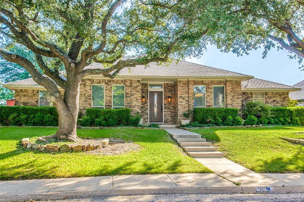 10216 Shadow Way Dallas, TX 75243 - Photo 1 of 1 a front view of a house with garden
