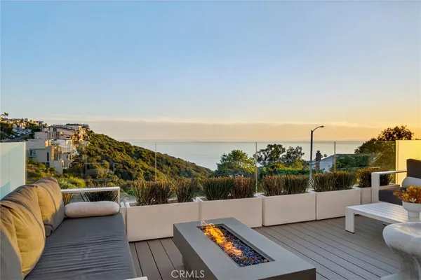 a view of roof deck with patio