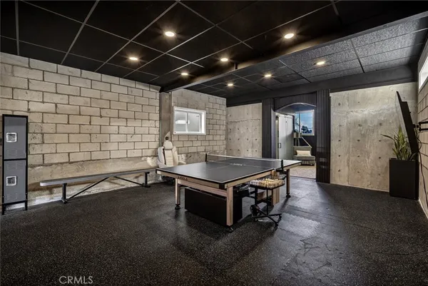 a kitchen with stainless steel appliances granite countertop a sink and a stove