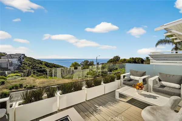 a view of a balcony with furniture