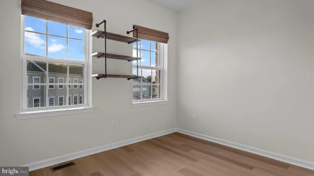 an empty room with windows