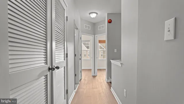 a view of a bathroom from a hallway