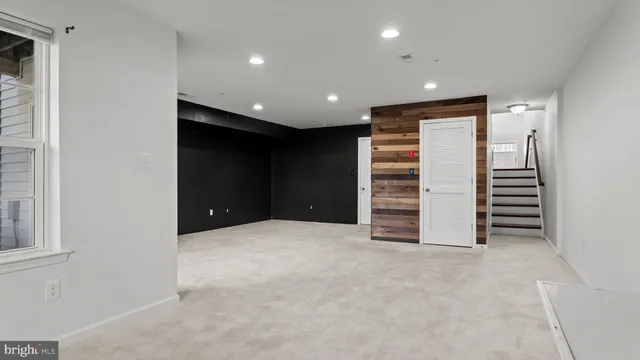 a view of an empty room with a fireplace