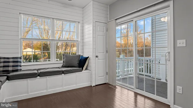 a living room with furniture and windows