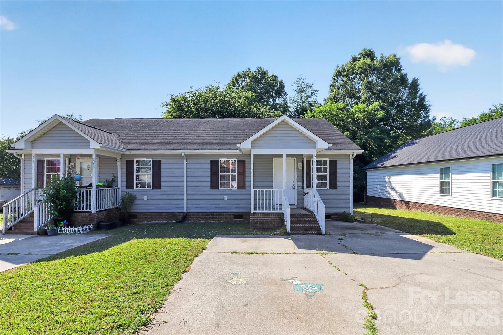 91-93 Sunderland Road Southwest, Unit 93 Concord, NC 28027 - Photo 2 of 30 a front view of a house with a yard