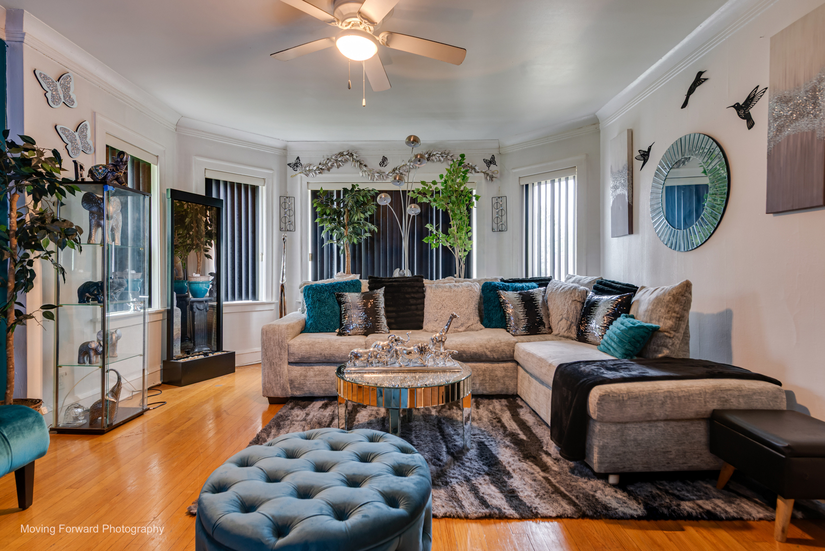 8213 South Indiana Avenue Chicago, IL 60619 - Photo 12 of 25 a living room with furniture and a chandelier