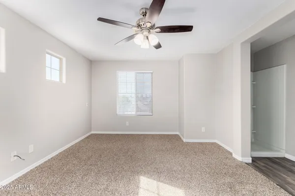a view of livingroom with hardwood floor and ceiling fan