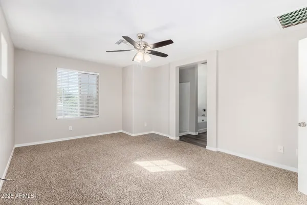 a view of an empty room with a window
