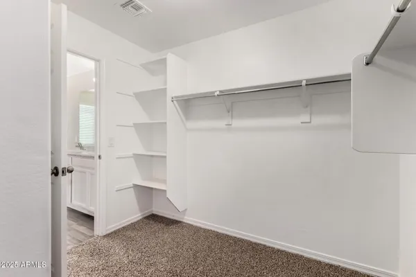 a view of an empty walk in closet