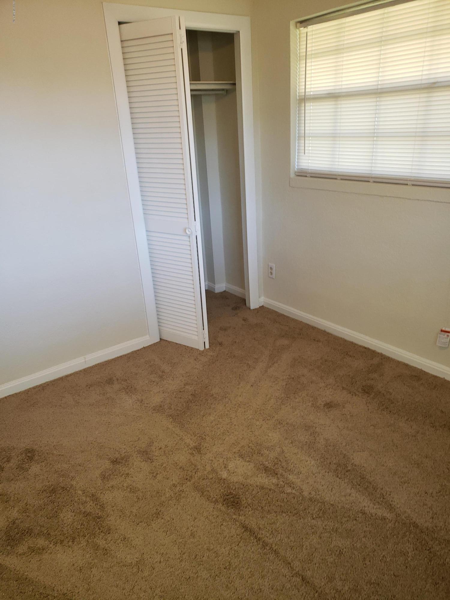 7110 Oakney Road Jacksonville, FL 32211 - Photo 12 of 15 an empty room with a window