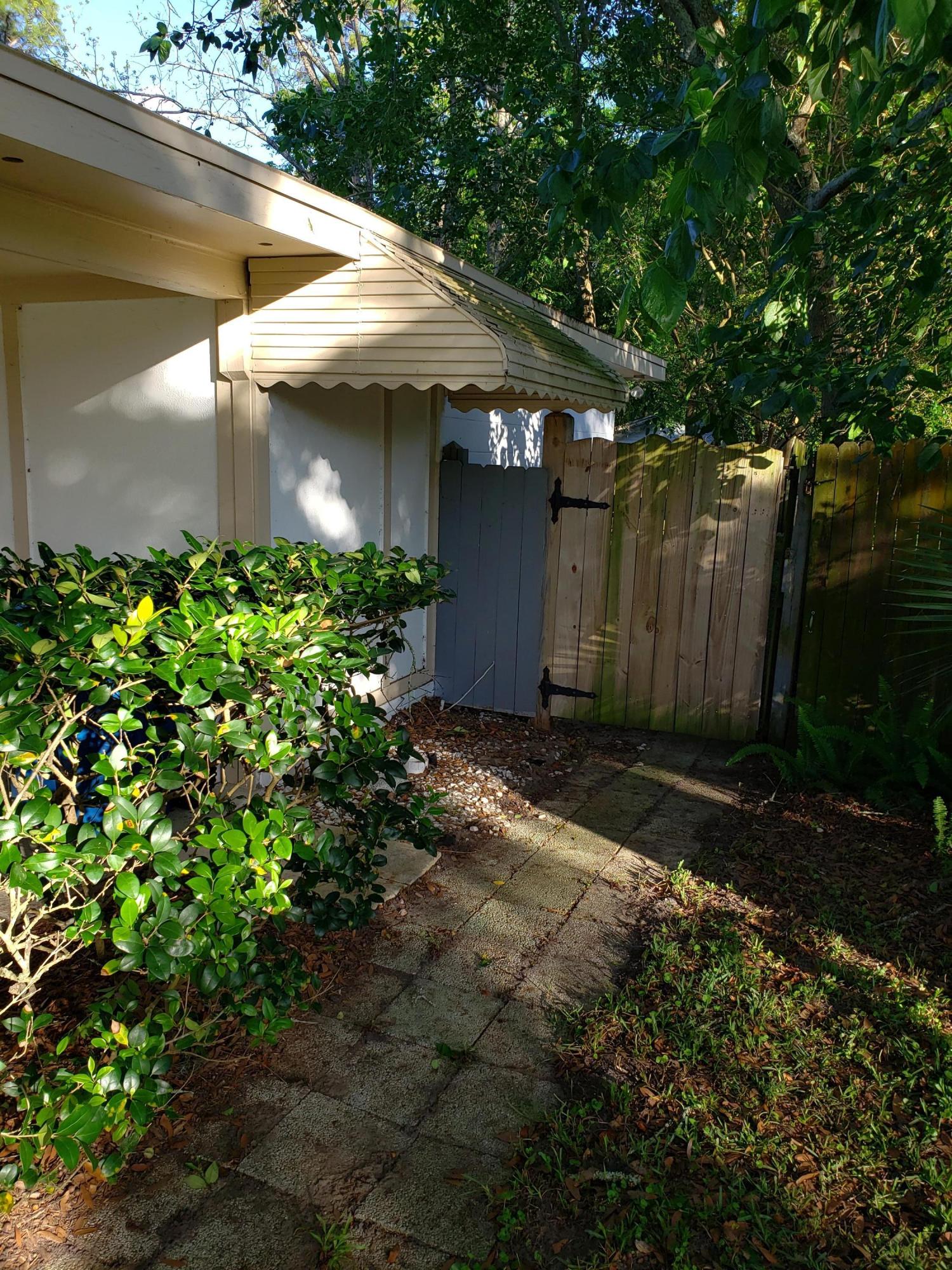 7110 Oakney Road Jacksonville, FL 32211 - Photo 2 of 15 a view of a house with a yard and tree s
