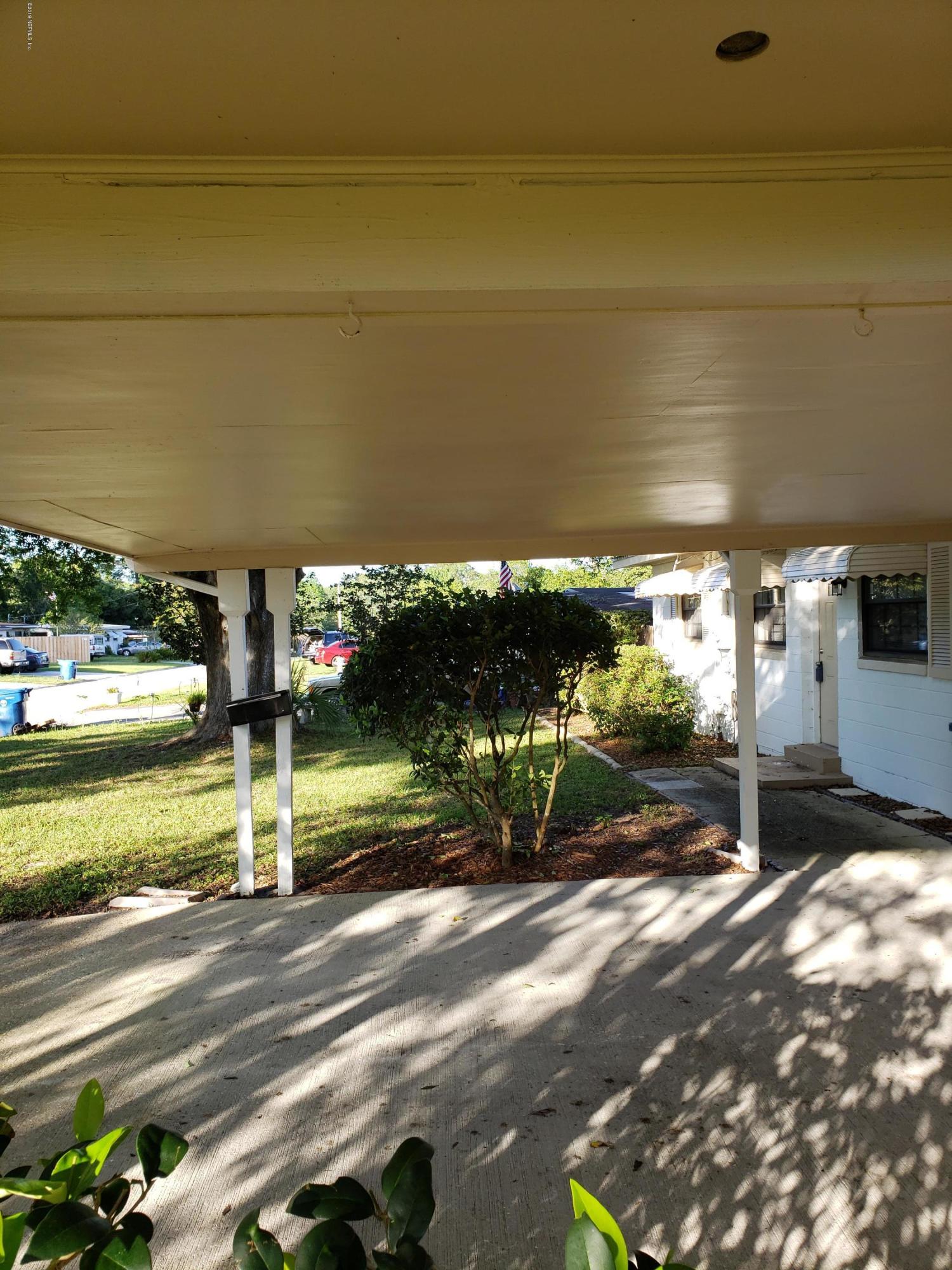 7110 Oakney Road Jacksonville, FL 32211 - Photo 3 of 15 a view of a street with an outdoor seating