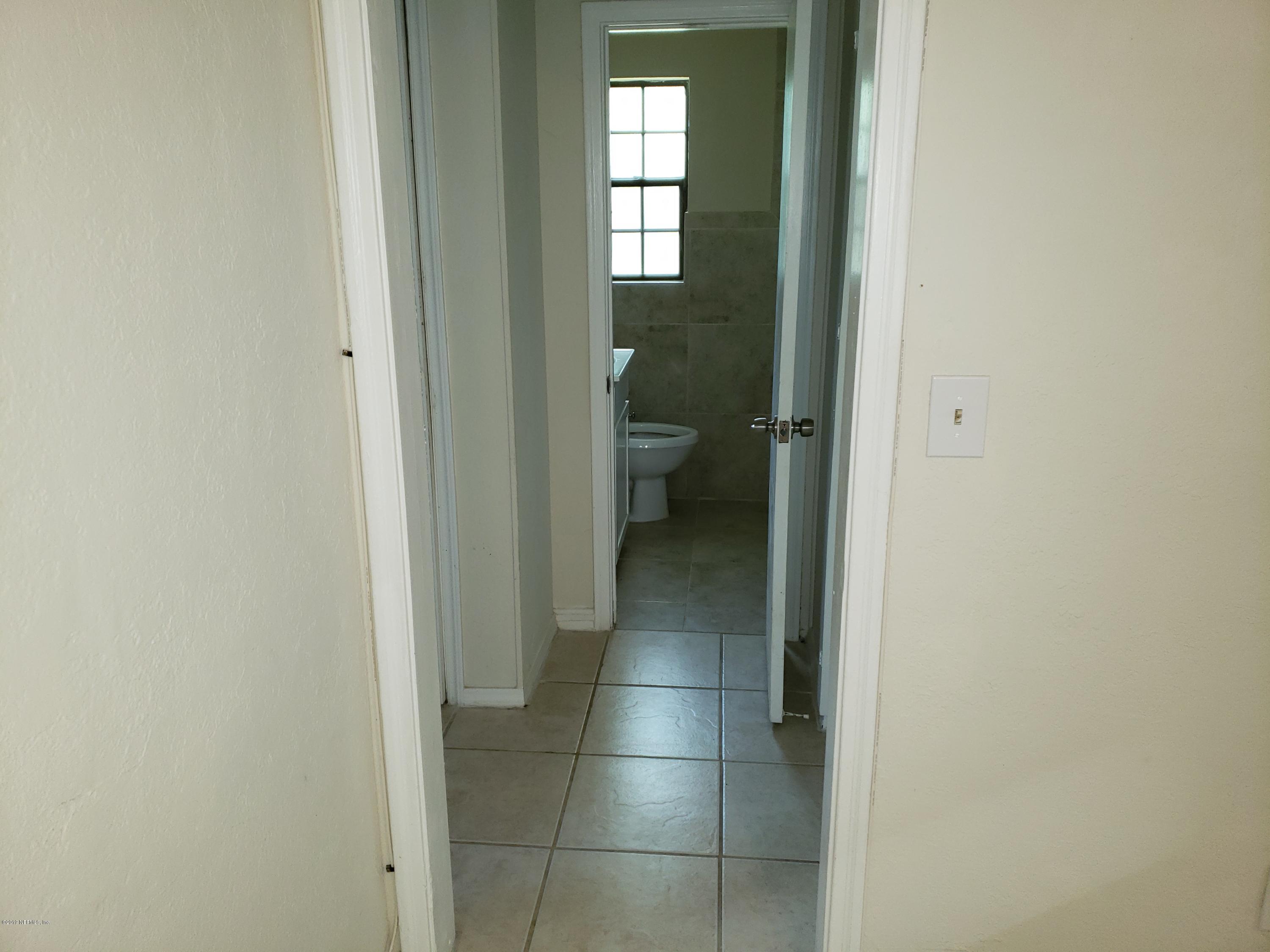 7110 Oakney Road Jacksonville, FL 32211 - Photo 8 of 15 a bathroom with a vanity and a toilet