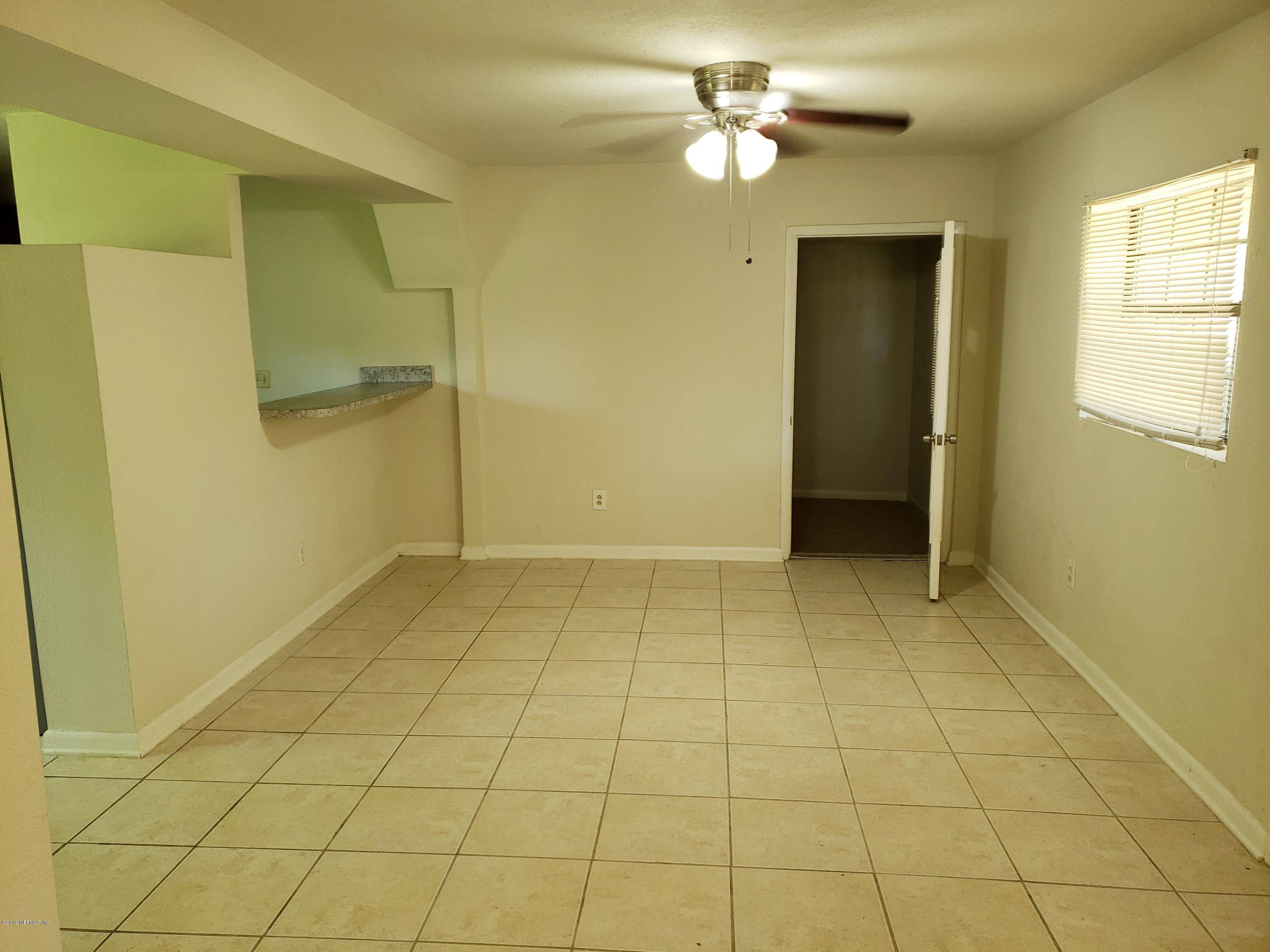 7110 Oakney Road Jacksonville, FL 32211 - Photo 9 of 15 a view of empty room with a fireplace