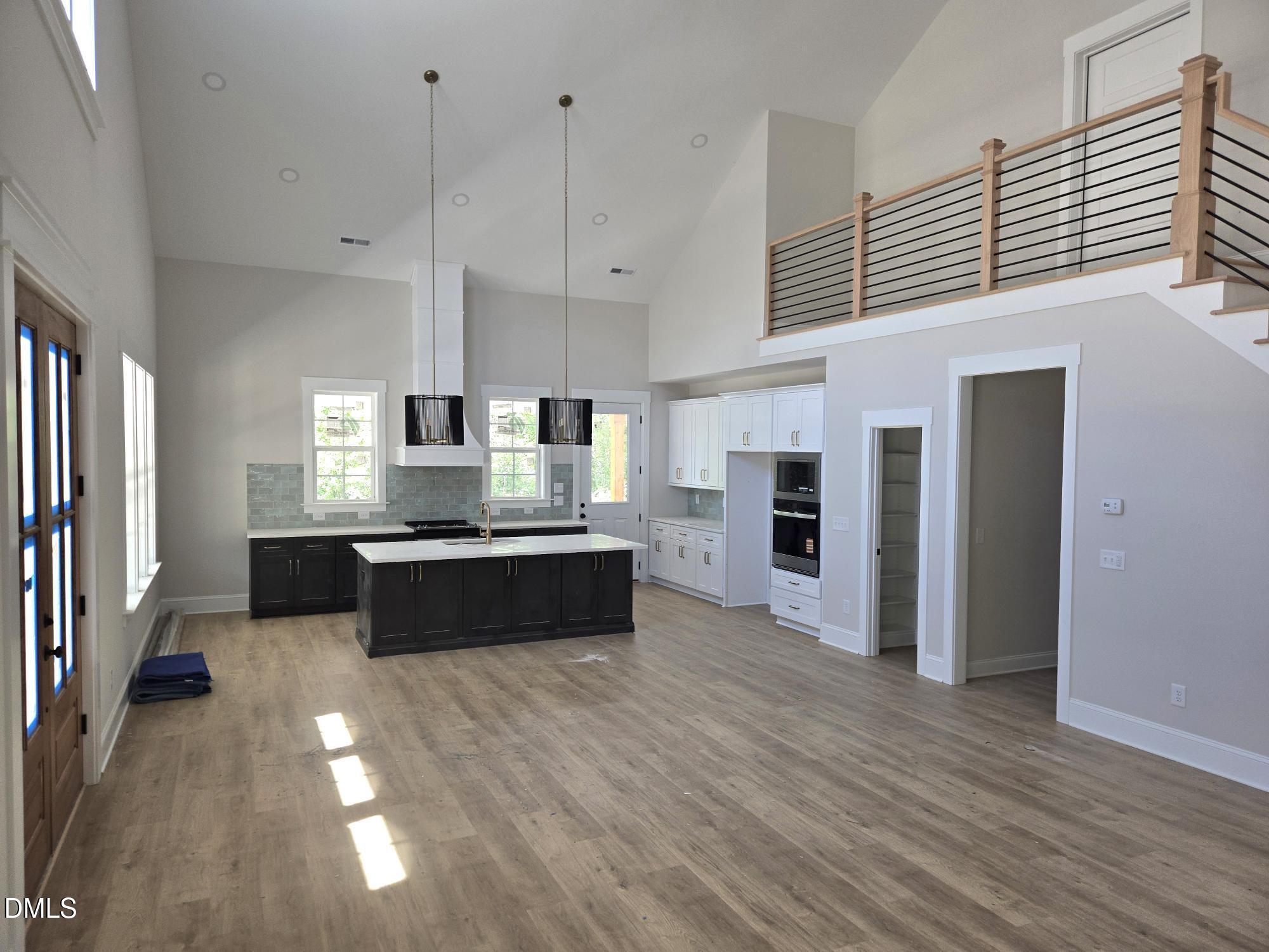 300 Avery Road Erwin, NC 28339 - Photo 2 of 38 a large white kitchen with stainless steel appliances granite countertop a stove and a refrigerator