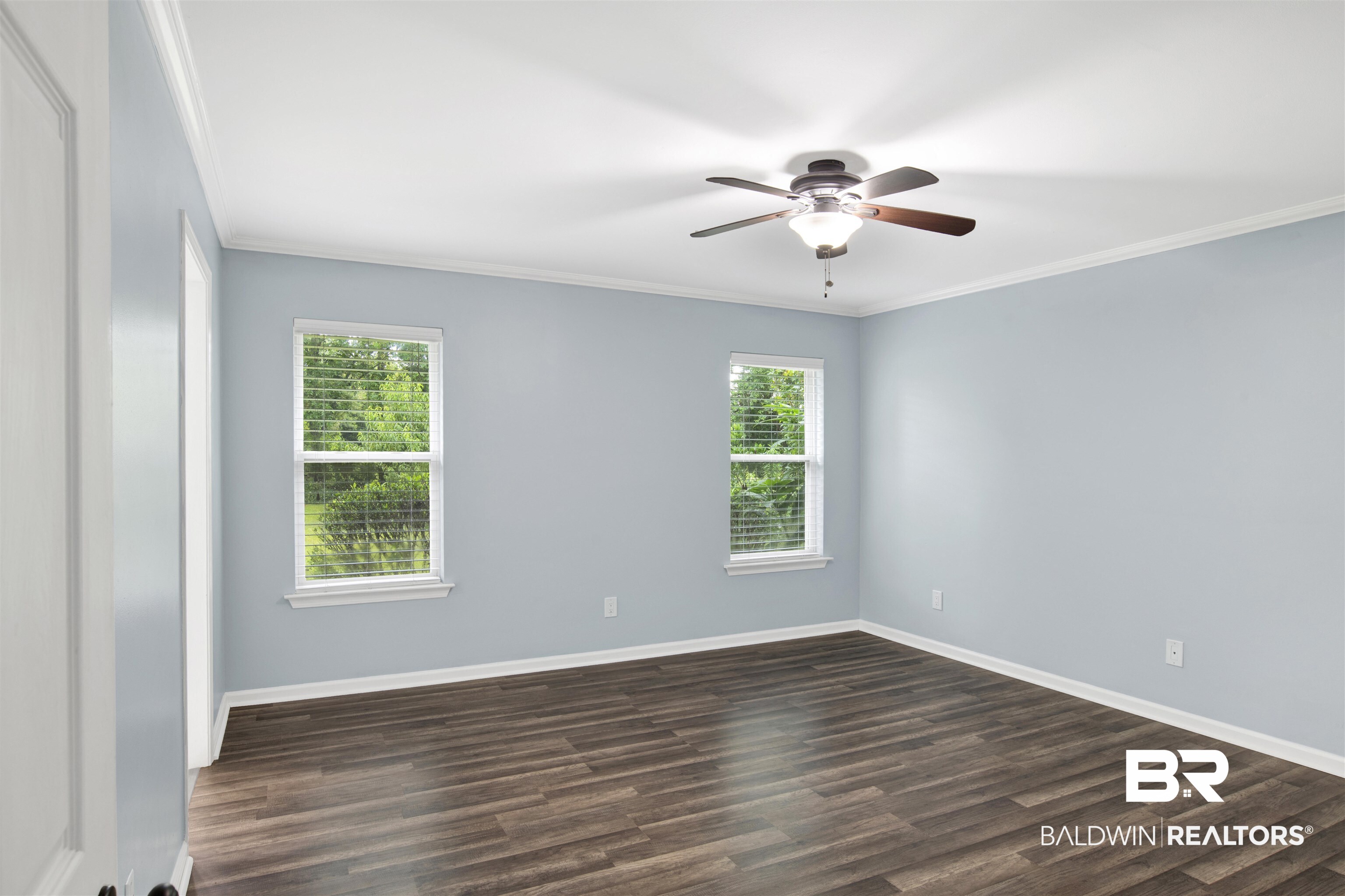 3011 Olde Gate Road Mobile, AL 36695 - Photo 25 of 35 Empty room featuring ornamental molding, ceiling fan, and dark wood-style floors