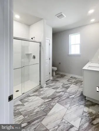a view of a bathroom with a sink and a shower