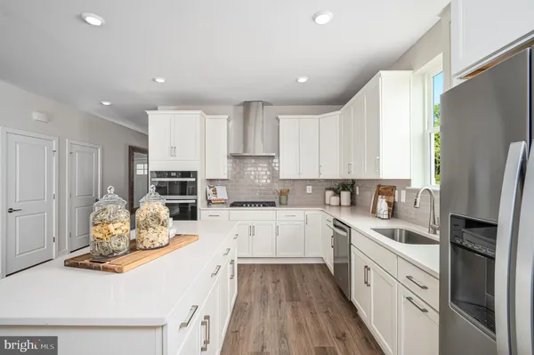 a kitchen with stainless steel appliances sink refrigerator microwave and stove