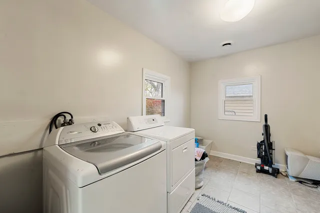 a bedroom with furniture and wooden floor