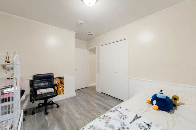 a view of a livingroom with furniture and a window