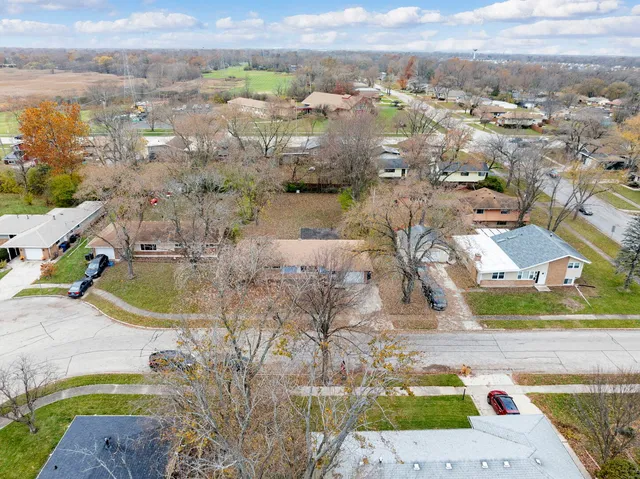an aerial view of residential houses with outdoor space